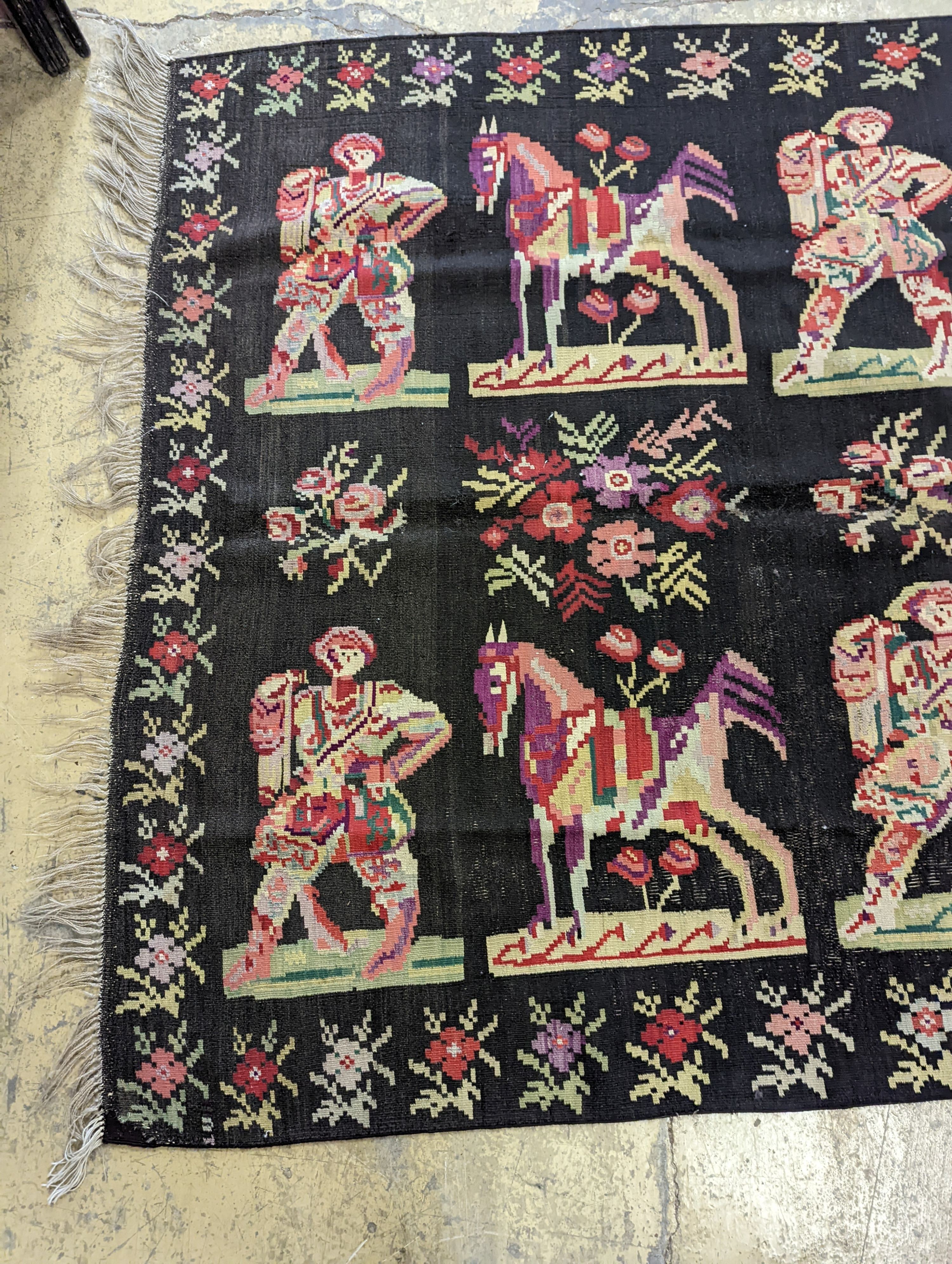 An antique Ukranian flatweave carpet woven with figures and birds, approx. 350 x 170cm